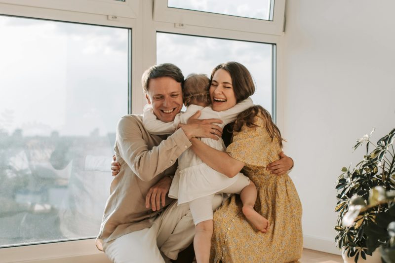 ourdays co parenting app parents hugging their child